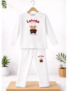 White pajama set with cartoon character and 'Lahnbu' text on a wooden stand with plants in the background.